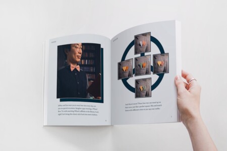 A person is holding open a magazine, showing a two-page spread. On the left page, there's a photograph of a man in a library, wearing glasses, a pinstripe blazer, a bow tie, and matching cufflinks, holding a book and seemingly reading it. The right page features multiple images of bow ties displayed in a geometric layout, suggesting they can stand alone as a fashion statement. The text accompanying the images discusses the idea of wearing bow ties daily, not just on special occasions, and mentions how "Jeffrey and Ian" want to bring this classic style back into men's fashion. The text also invites readers to mix and match different colors of these bow ties to add flair to their outfits. The layout is clean and modern, with a focus on style and fashion accessories.